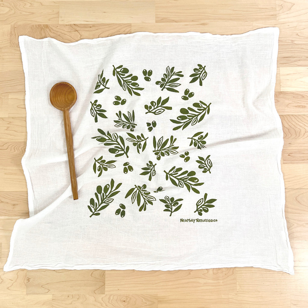 Kei & Molly Olive flour sack dish towel printed in Green color, front view with spoon prop