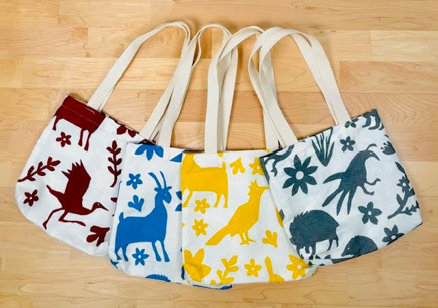  Kei & Molly Textiles Mini Tote Bags with "Buffalo & Friends" design printed in four different colors Full View