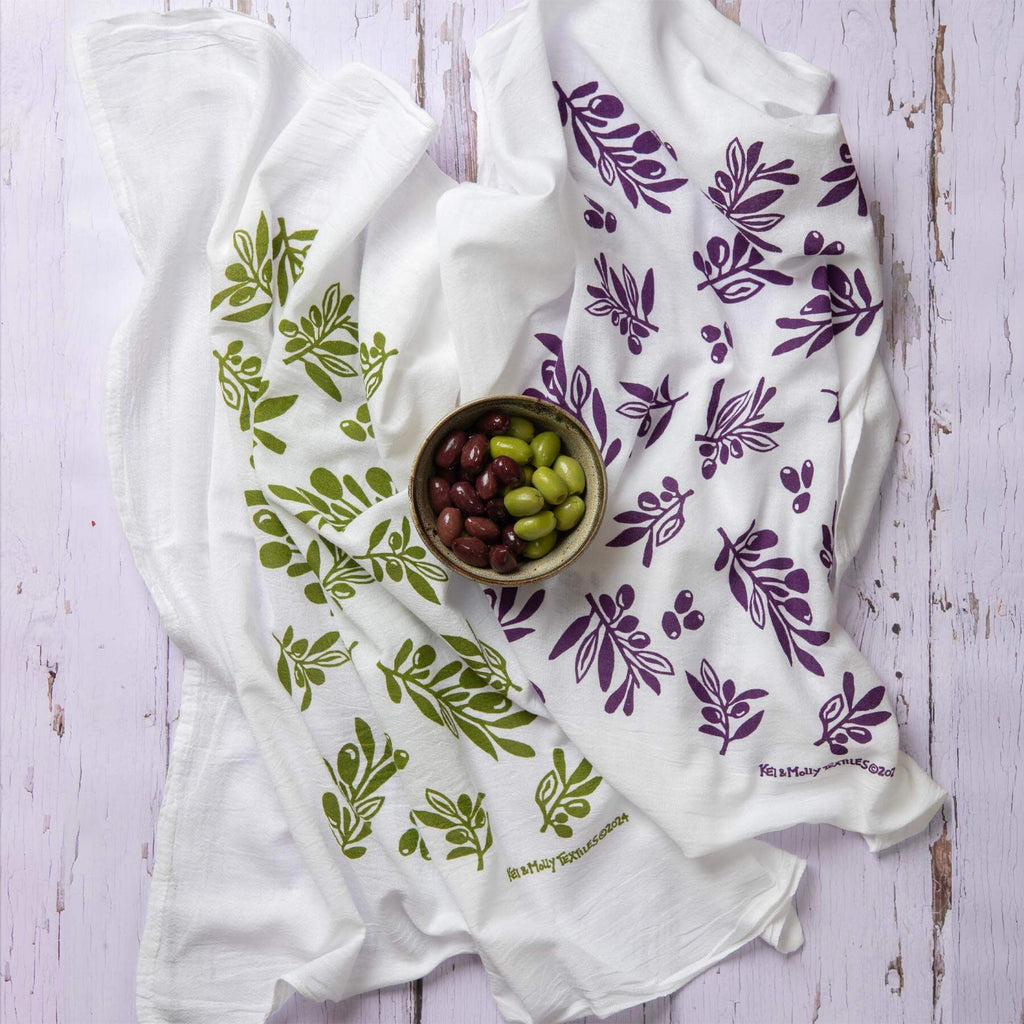 Kei & Molly Olive flour sack dish towel printed in Green and Grape color, with prop